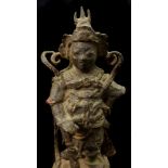 A Chinese cast iron figure of a warrior standing upon a pierced rocky outcrop, some traces of red,