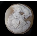 A 19th Century carved shell cameo, depicting Hebe and the Eagle, she feeding the bird from a vase,