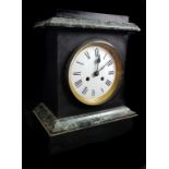 A black slate mantel clock with variegated green marble details, modern quartz movement, 33cm high