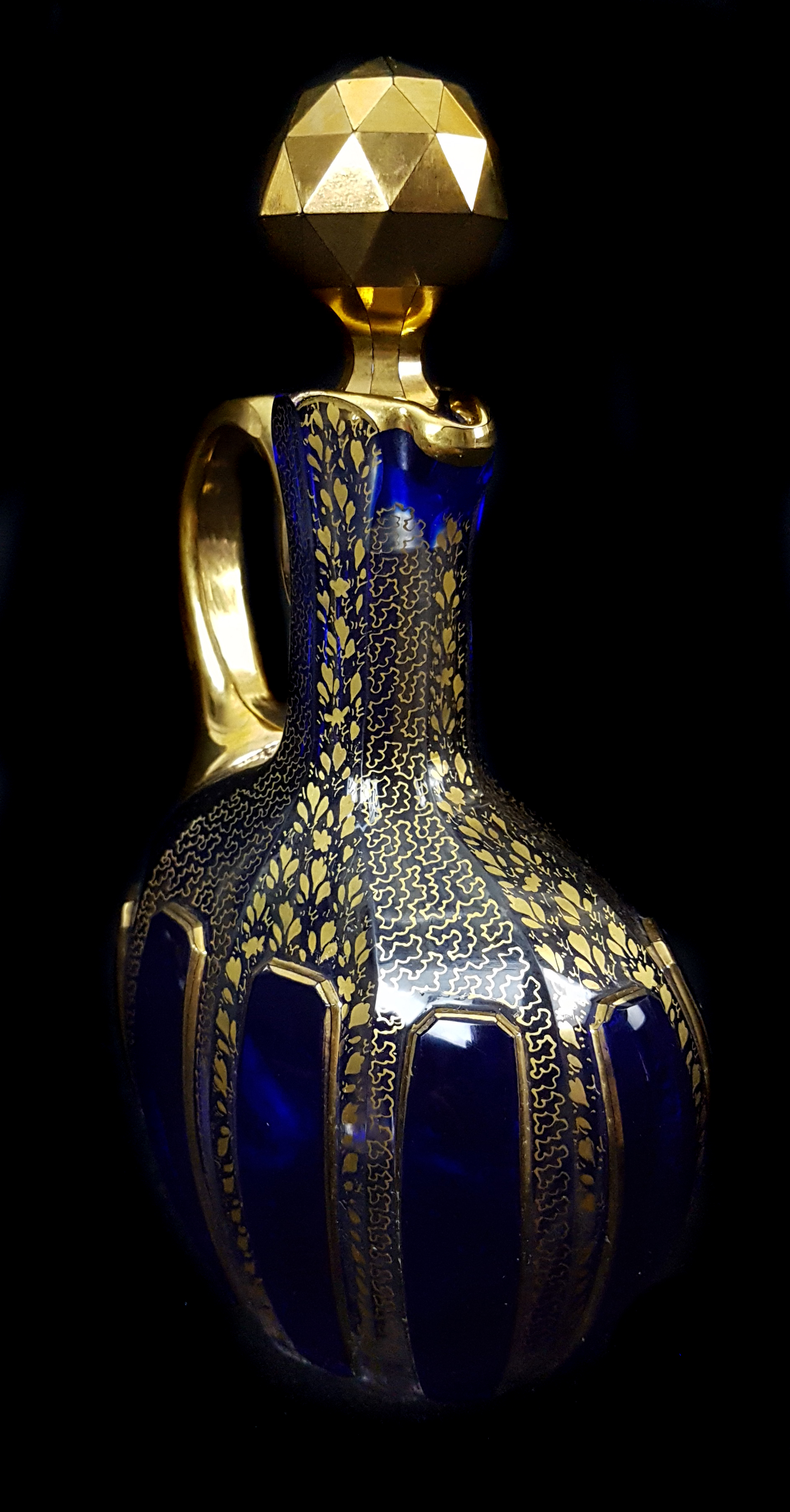 A Bohemian cobalt blue cased small sized liqueur flask and stopper, of claret jug form, the casing