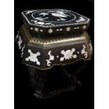 A Chinese Republic period lacquered wood stand, inlaid with peony and bird motifs, canted square top