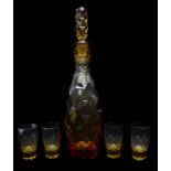 Moser - A dichroic amber/red glass decanter and stopper of slender ovoid form cut with diamond