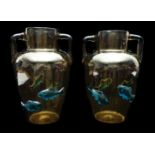 Harrach - A pair of burnt amber two handled glass urn vases, each applied with electric blue