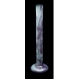 Emile Galle - A tall fire polished cameo glass bottle vase, the white body overlaid in amethyst