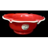 A Czechoslovakian Tango deep red glass bowl circular with wavy rim trailed in cream glass and with