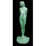 Eve- An Art Deco lead doorstop, the nude figure modelled standing holding a apple behind, cast