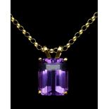 A Emerald cut amethyst pendant, 1cm x 0.7cm; set in 9ct gold; on a 9ct gold belcher link chain,