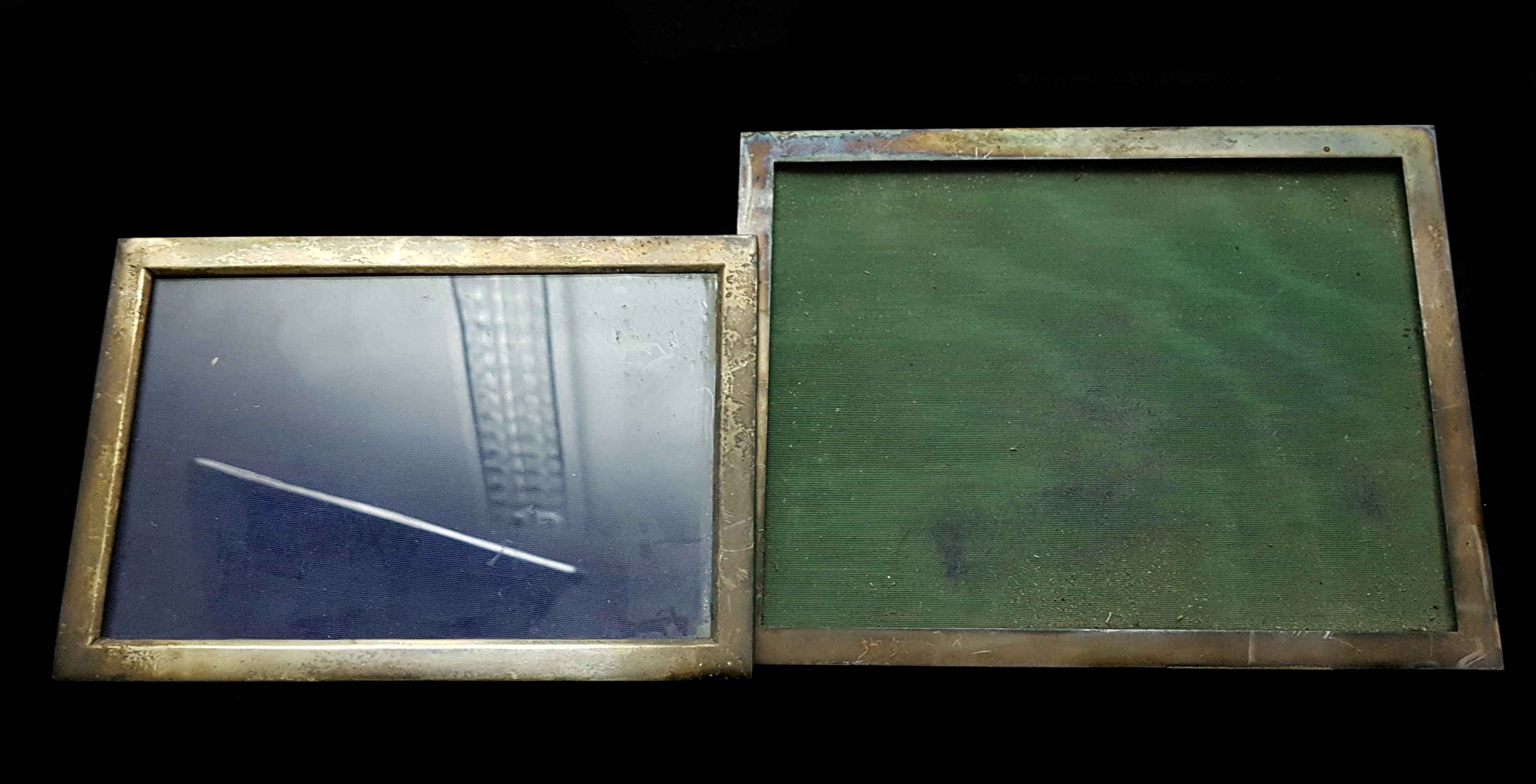 Two silver rectangular photograph frames, Birmingham 1912; and 1911, 23 x 17.5cm max and smaller (