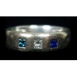 An 18ct white gold court band, pave set with a single sapphire, diamond and aquamarine, ring size S