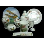 A Coalport Tiger Moth Limited Edition plate; A Royal Worcester Christmas loving cup; a Royal