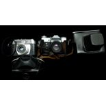 Photographic Equipment - Two Cameras; Zenit E, cased; Halina Paulette Electric, cased (2)