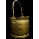 A brass helmet form coal scuttle, 42cm high