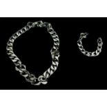 A silver curb chain and bracelet (both need clasps fitting), total weight 142grms