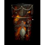 An early 19th Century tortoiseshell etui inlaid with silver with foliate swags and stars with vacant