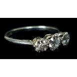 An 18ct Platinum three stone diamond ring, ring size L