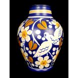 A Boch Freres Keramis vase, decorated with birds within flowering and fruiting branches in cobalt