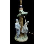 LLadro porcelain - a rare Pierrot and Ballerina figural lampbase, the figures posed around a leafy