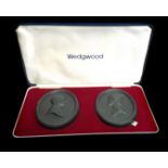 A pair of Wedgwood black basalt commemorative medallions, oval, for the Royal Silver Wedding 1972,