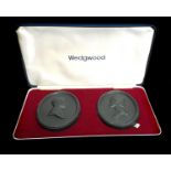 A pair of Wedgwood black basalt commemorative medallions, oval, for the Royal Silver Wedding 1972,