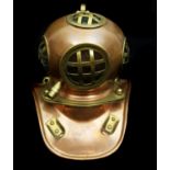 A reproduction miniature deep sea divers helmet, in copper and brass with glass panels, 17cm high