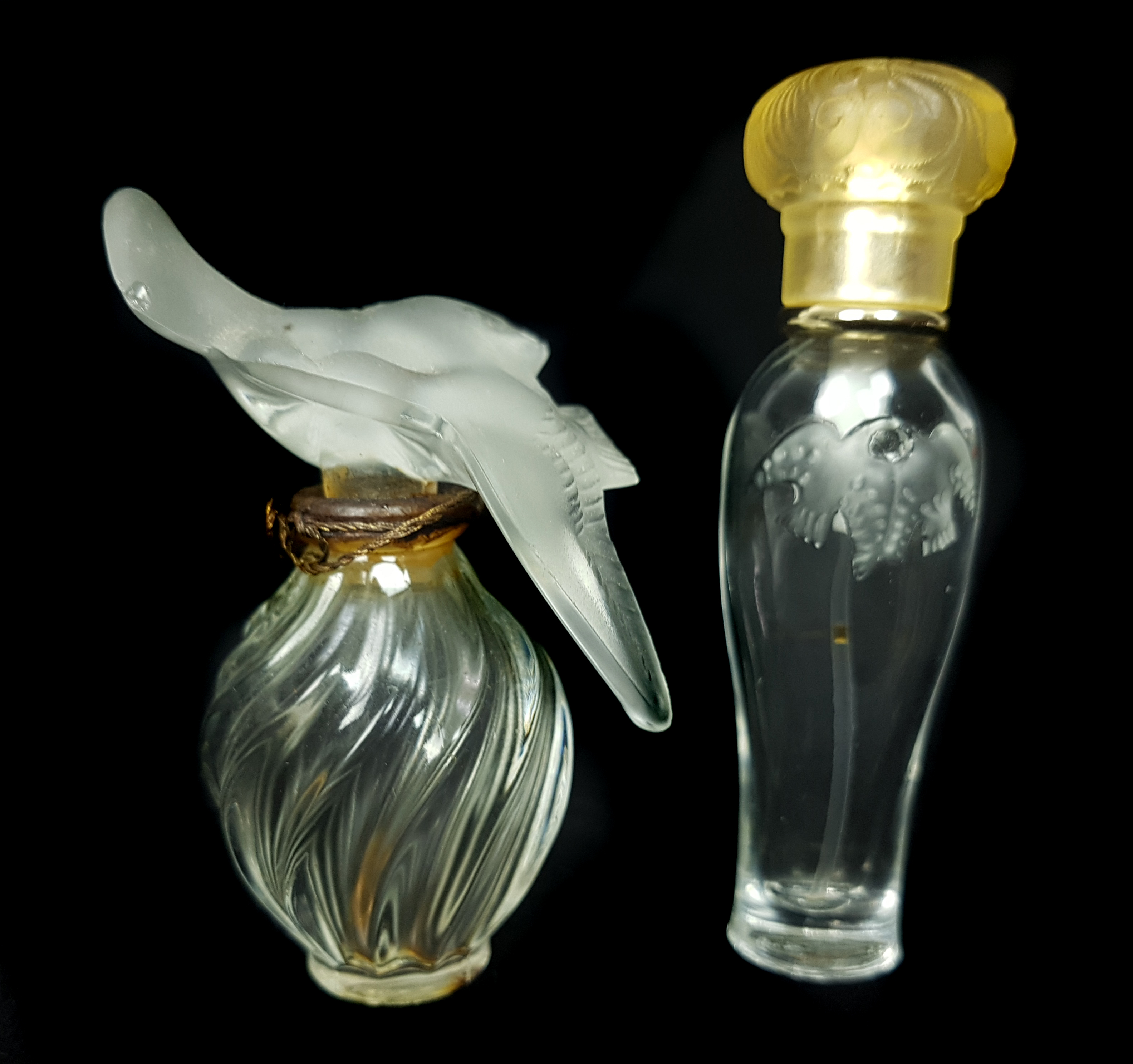 L'Air du Temps -Nina Ricci- A Lalique Glass bottle, of small size, spiral fluted ovoid body with