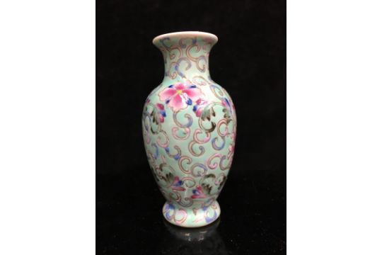 A miniature Chinese famille rose porcelain baluster vase, decorated with scrolling peonies on a pale - Image 6 of 6