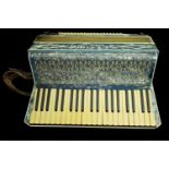 A Settimio Soprani three piano accordian, in hard case, blue nacreous decorated case (2)