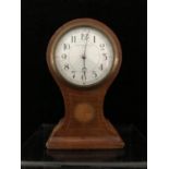 An Edwardian Satinwood baloon clock, french movement, retailed by Pearce & Sons Ltd, Leeds, the case