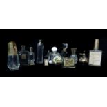 A group od Commercial Perfume bottles and other items including: A Victorian white metal mounted