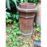 A brown terracotta pottery chimney pot, of octagonal section, 70cm high x 307cm diam VIEWING