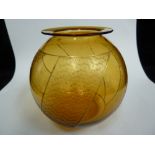 Moser - An Art Deco amber glass globular vase, cut with panels of tessellating propellor/trefoil