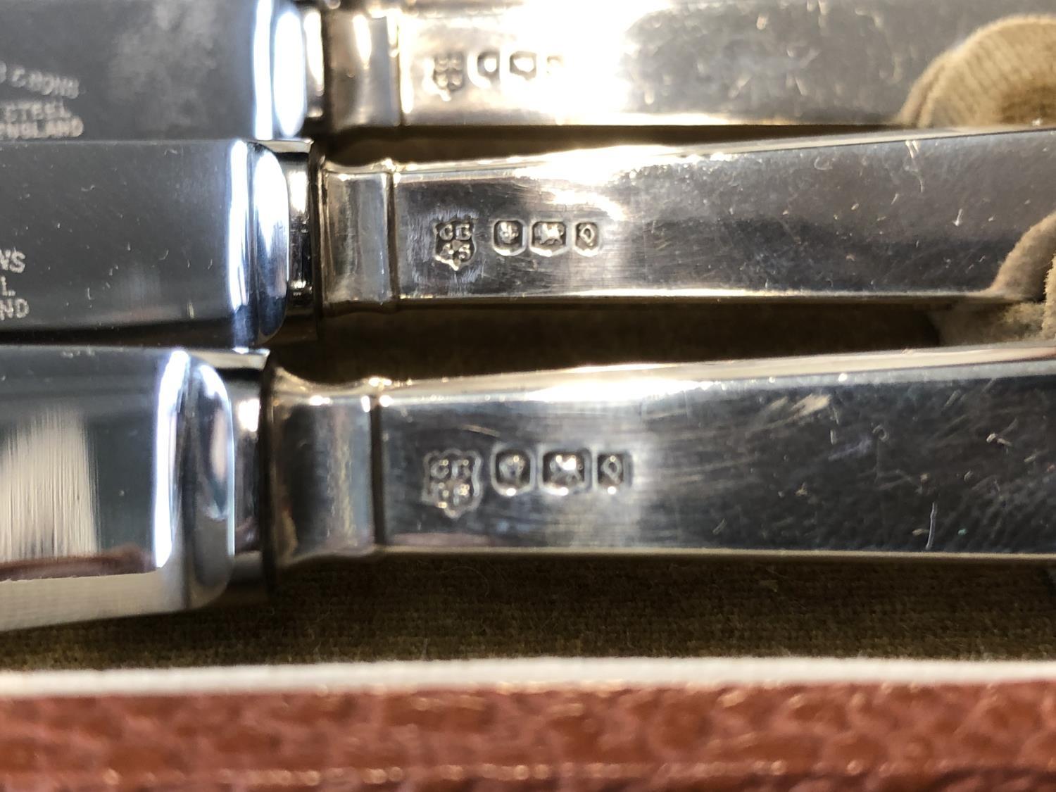 A cased set of six silver handled butter knives, stylised reeded pistol handles, stainless steel - Image 2 of 6