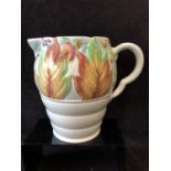 A Clarice Cliff pottery Jug, in Celtic leaf and berry pattern, jade green ground with leaves and