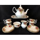 A Royal Albert Old Country Roses pattern part teaservice, comprises sandwich plate, teapot and
