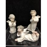 Three small Lladro porcelain Angel figures: comprising: Angel laying down, No 4541; \\angel with
