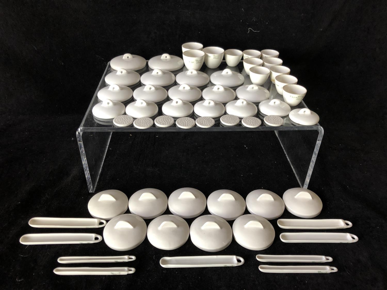 A quantity of Royal Worcester porcelain laboratory porcelains, crucibles, covers, sieves etc; and