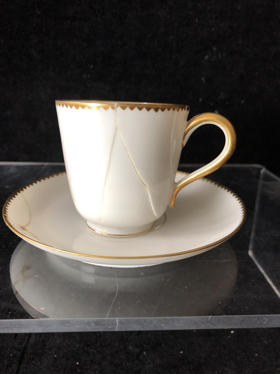 A Minton coffee cup and saucer, enamelled with cyclamen flower heads interspersed with cyclamen - Image 4 of 19