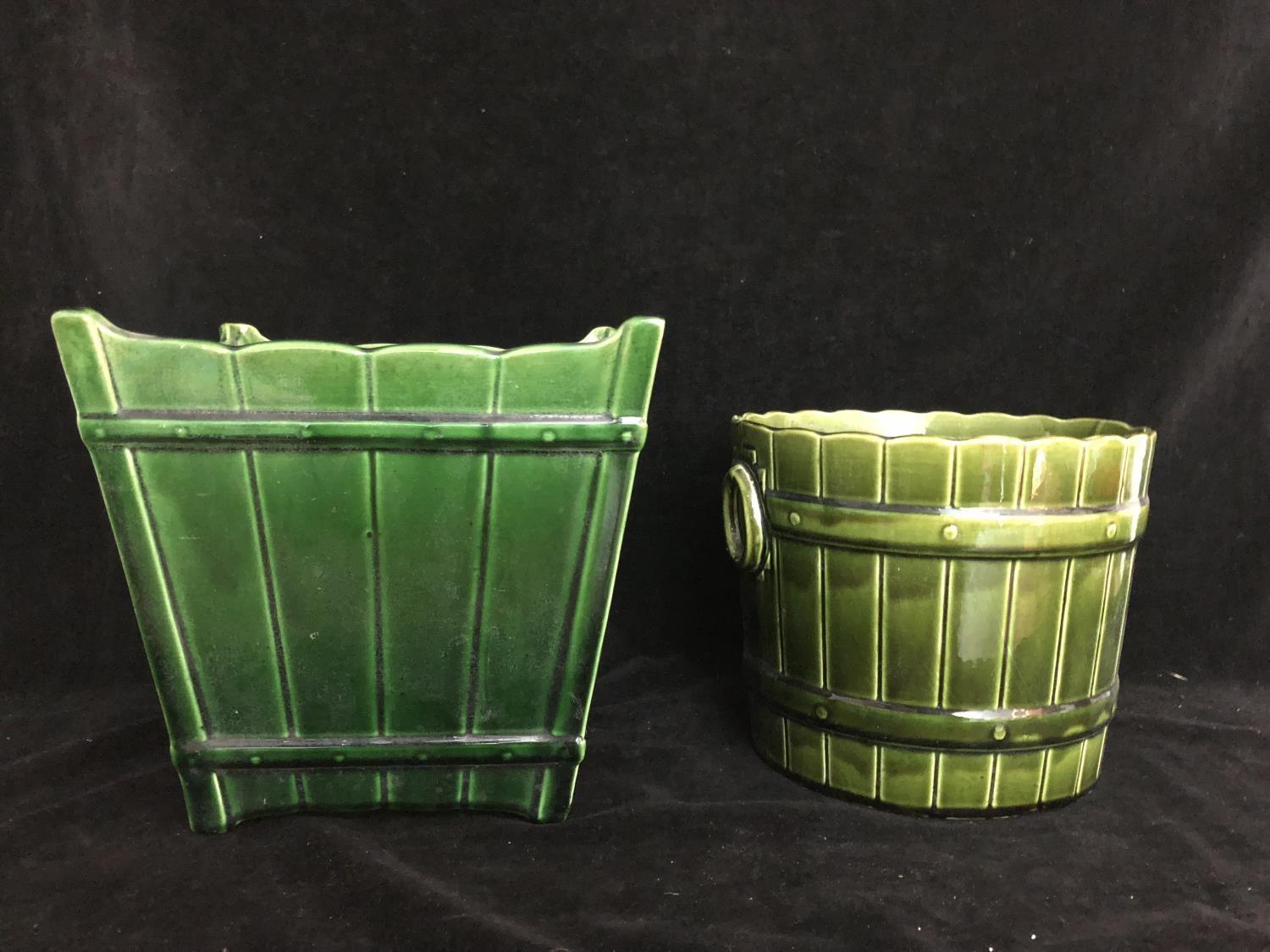 Two majolica green glazed jardinieres, one by T F & Sons, of Gypsy 3 shape, barrel form with faux