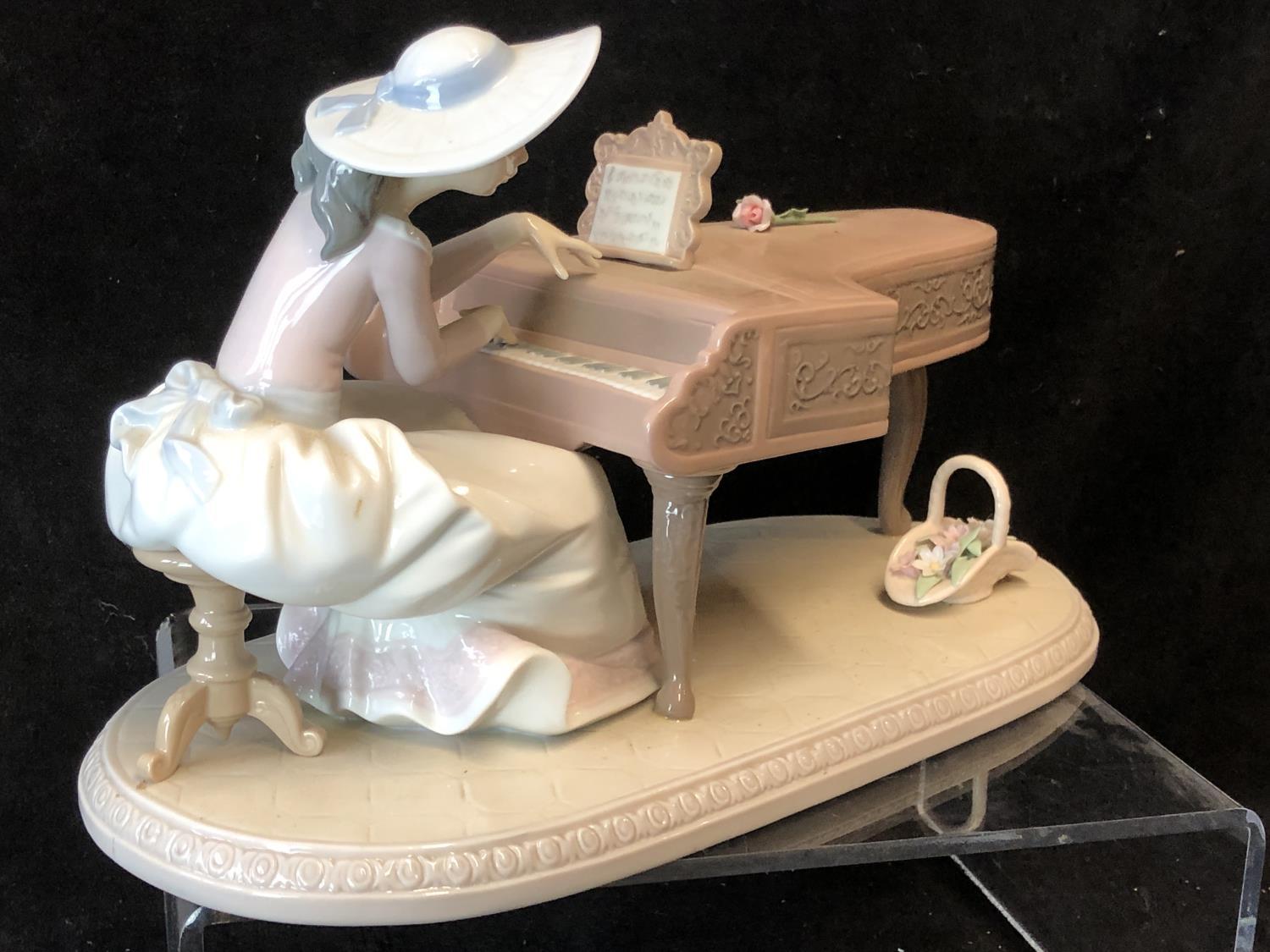 Lladro Porcelain- Spring Recital, No 6427, a young girl in a broad rimmed hat seated at a grand - Image 2 of 5