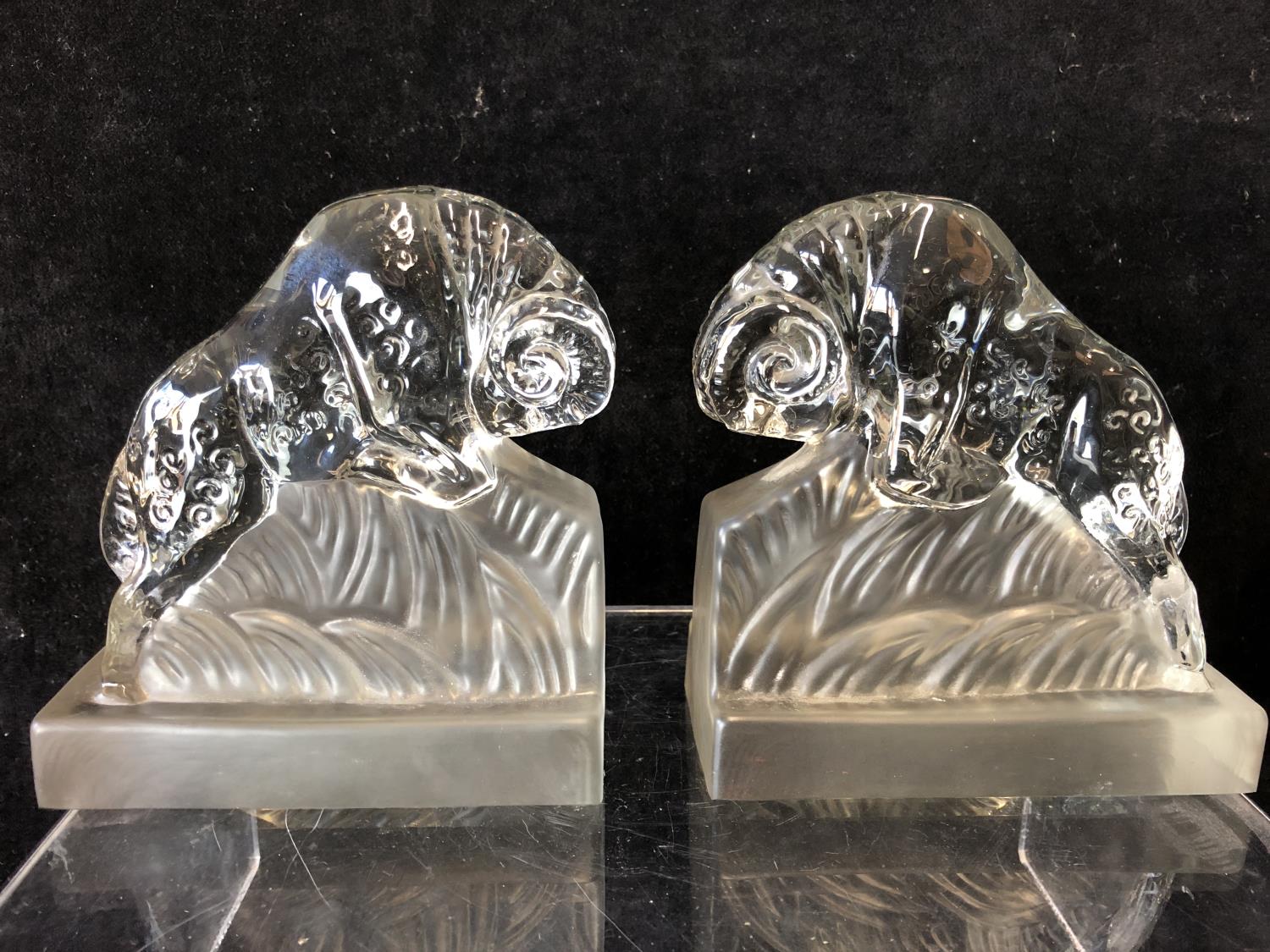 A pair of Art Deco glass book ends modelled as charging rams, by the Libochovice glass company and