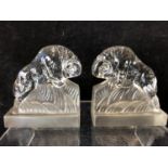 A pair of Art Deco glass book ends modelled as charging rams, by the Libochovice glass company and