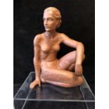 An Art Deco style terracotta figure of a seated nude female, probably Austrian, impressed 12 to