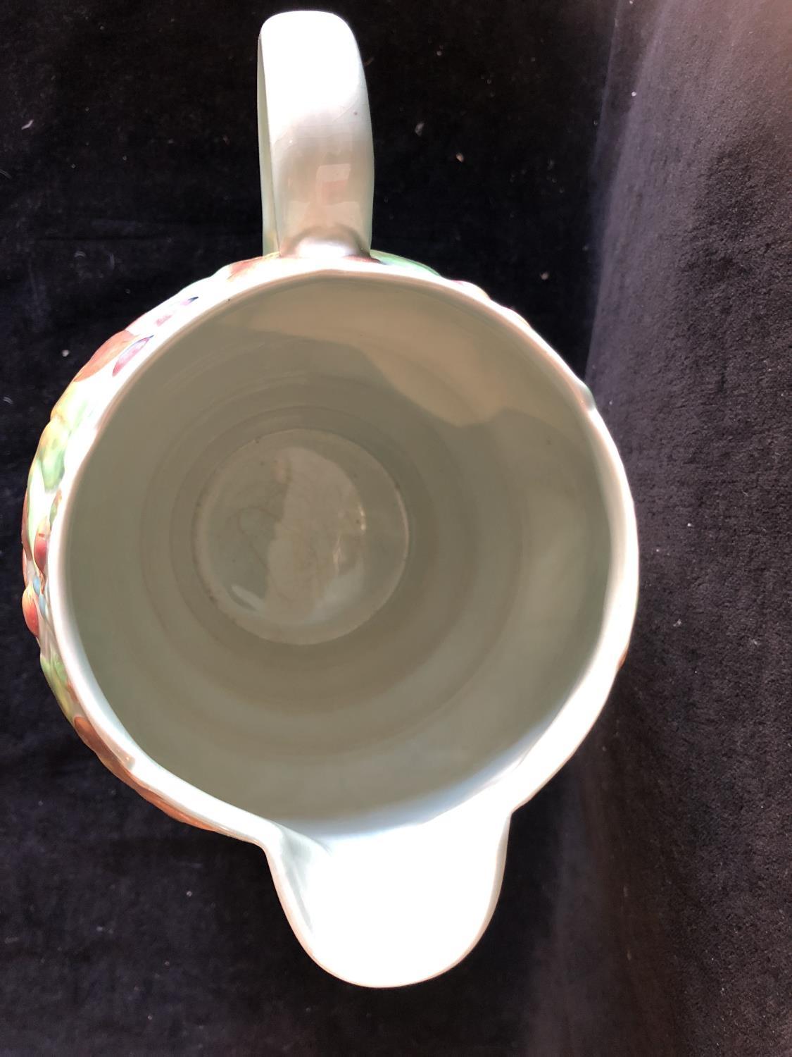 A Clarice Cliff pottery Jug, in Celtic leaf and berry pattern, jade green ground with leaves and - Image 4 of 6