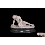 A CARVED ALABASTER FIGURE OF "THE WOUNDED GAUL", after the antique,