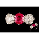 A RUBY AND DIAMOND THREE STONE RING, one cushion cut ruby of approx. 1.