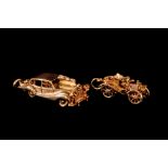 A PAIR OF 9CT GOLD VINTAGE CAR CHARMS, one modelled as a Rolls Royce silver raith,