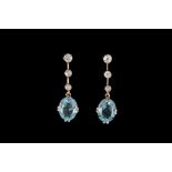 A PAIR OF AQUAMARINE AND DIAMOND PENDANT DROP EARRINGS, two oval aquamarines of approx. 3.