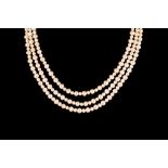 A TRIPLE ROW FRESHWATER PEARL NECKLACE