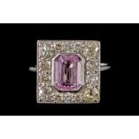 A PINK SAPPHIRE AND DIAMOND PLAQUE RING, the emerald cut sapphire of approx. 1.