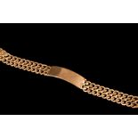 A 9CT GOLD ID BRACELET